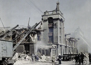 French fire fighters, military and civilians trying to prevent fires from spreading after the bombings of September 2 and 3, which affected several buildings in Dunkirk